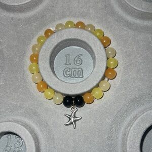 Yellow and Black Beaded Bracelet with Starfish Charm